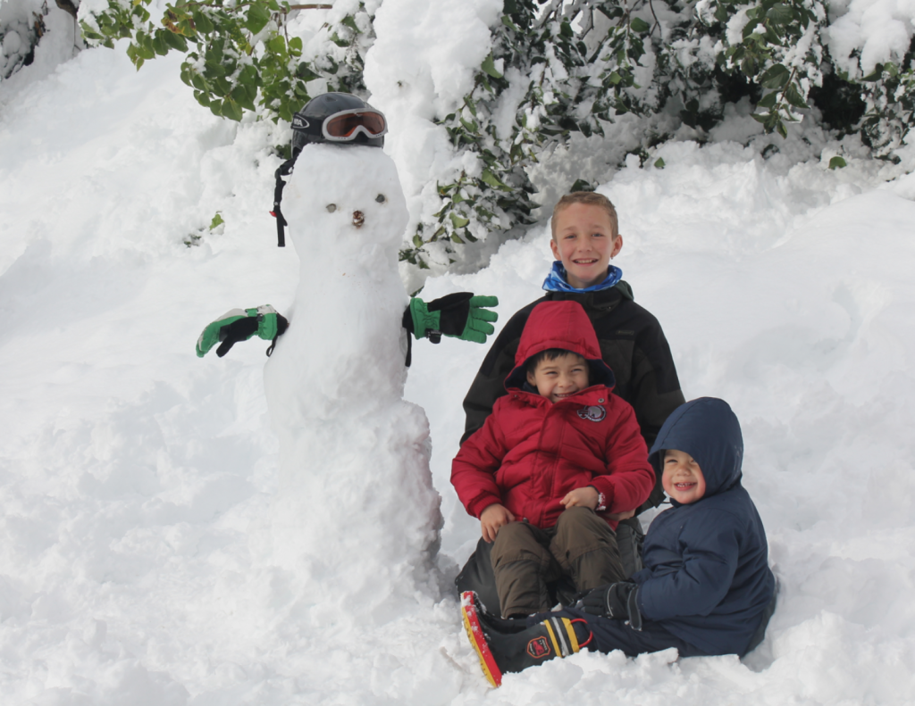 Anton, Lukas, and Armando build a snowman