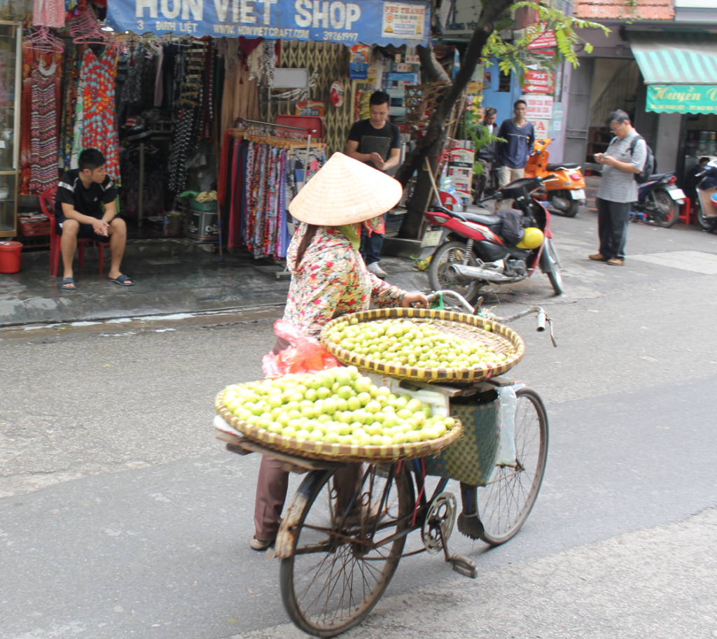 Woman selling apples on the street.